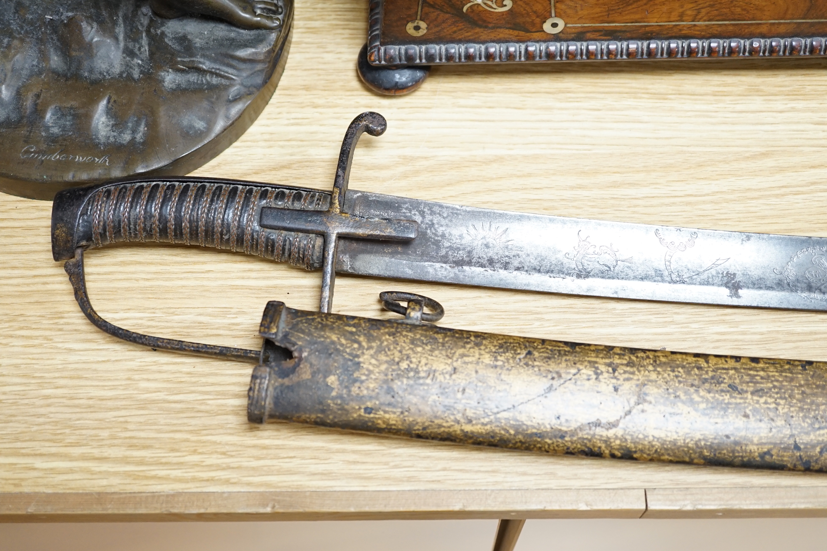 An 18th century English cavalry sword with eastern related engraving to blade